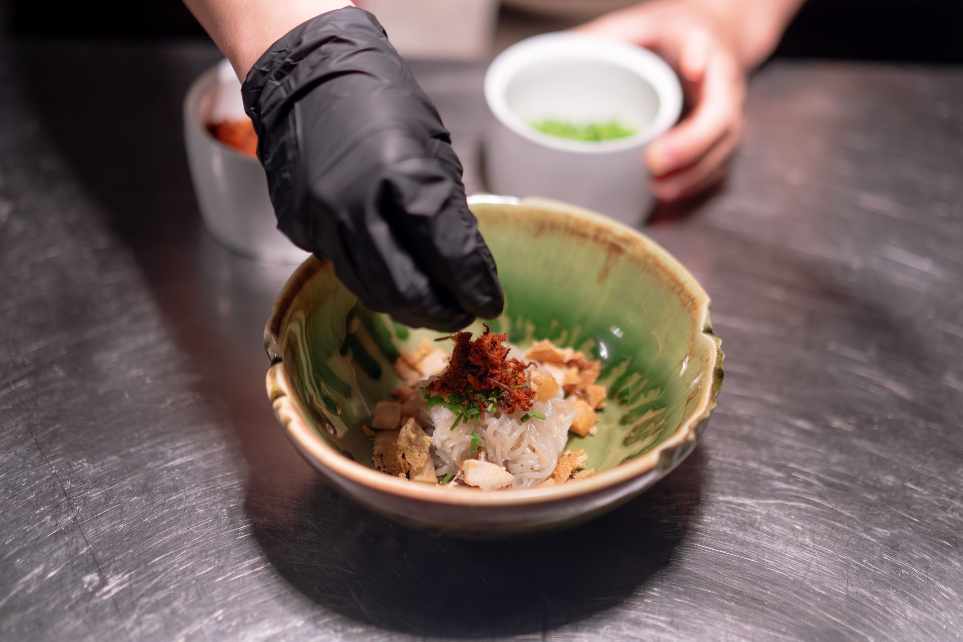 Chef Preparing Plating Fresh Garnish on Noodle Dish Mie Lethek